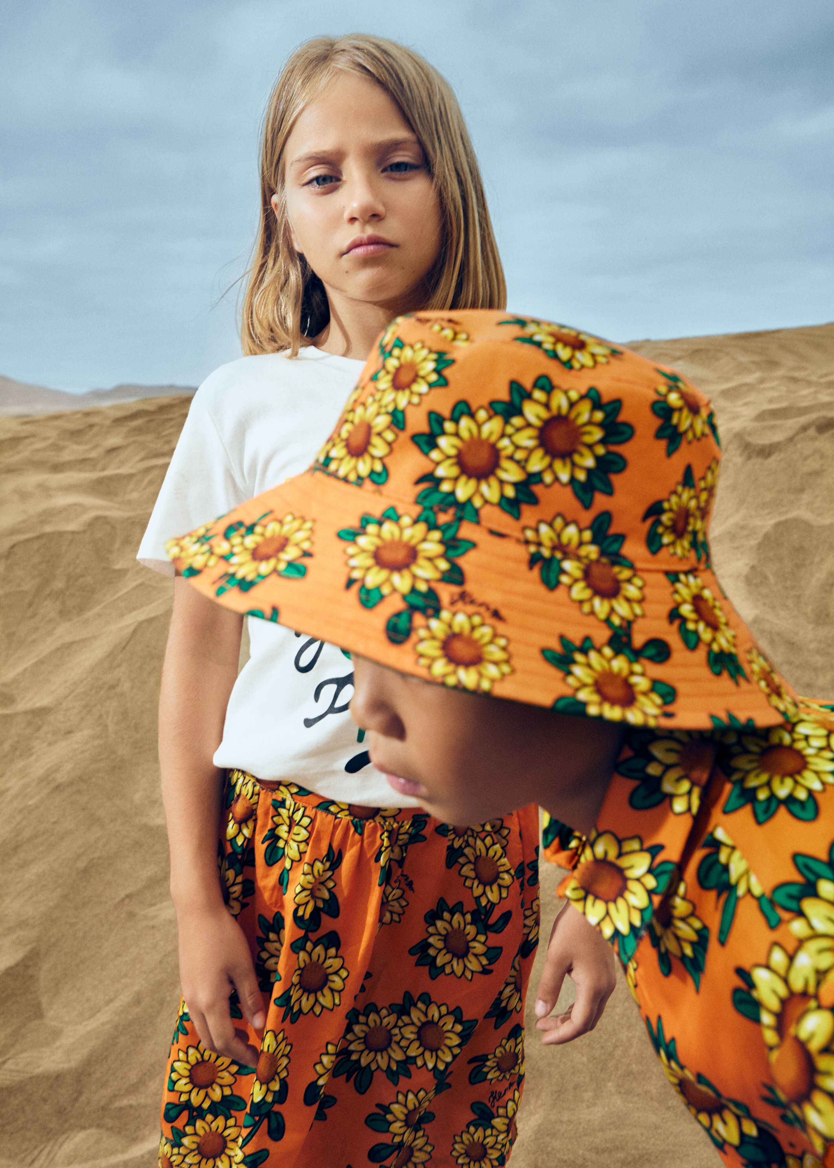 Kenzo kids look for girls and boys: floral outfits with sunflower prints, colorful premium and luxury fashion at Kidsaround