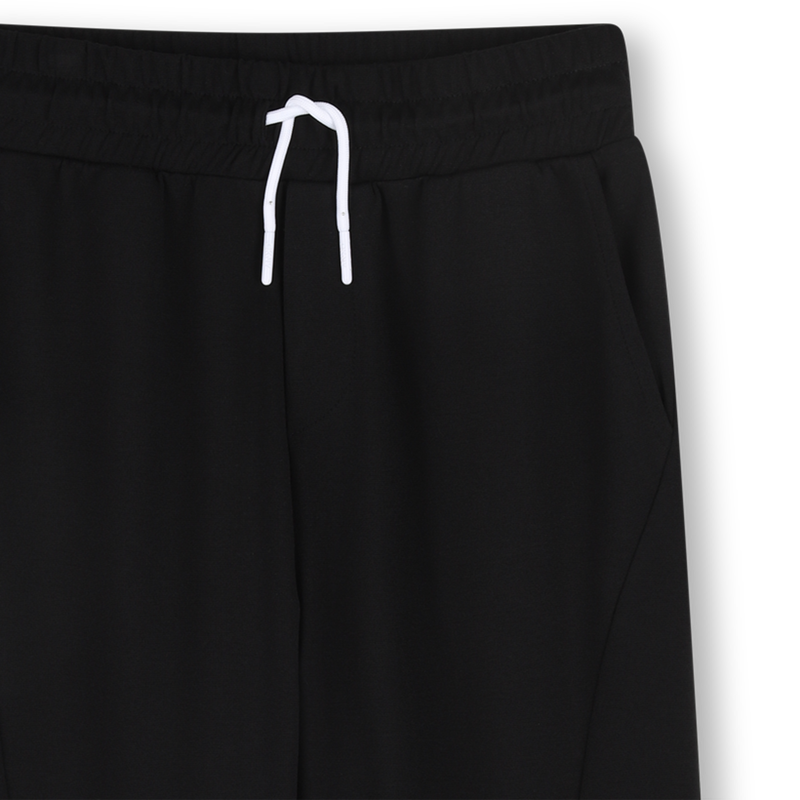 TROUSERS WITH POCKETS DKNY 
                        UNISEX